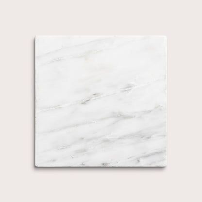 White casablanca carrara marble tiles on a light gray background