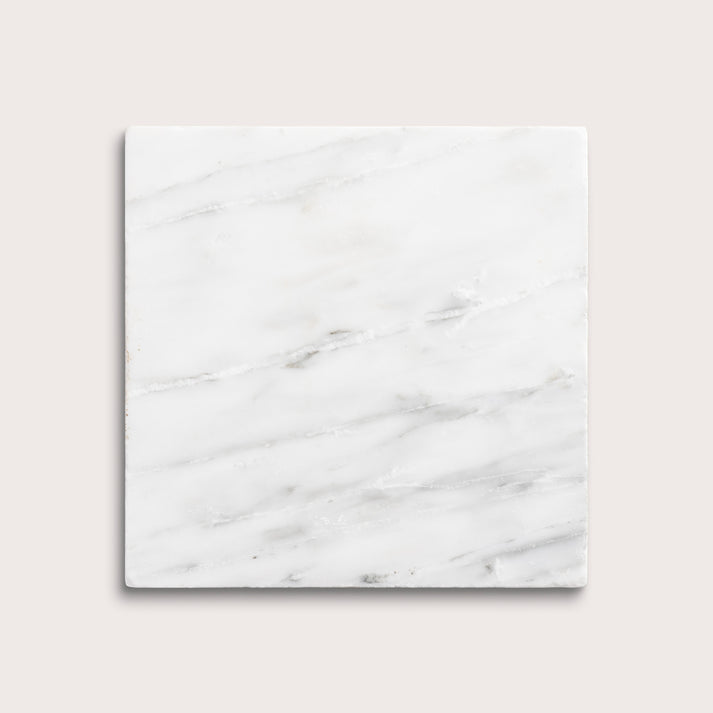White casablanca carrara marble tiles on a light gray background