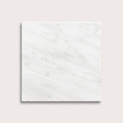 White casablanca carrara marble tiles on a light gray background