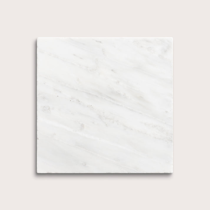 White casablanca carrara marble tiles on a light gray background