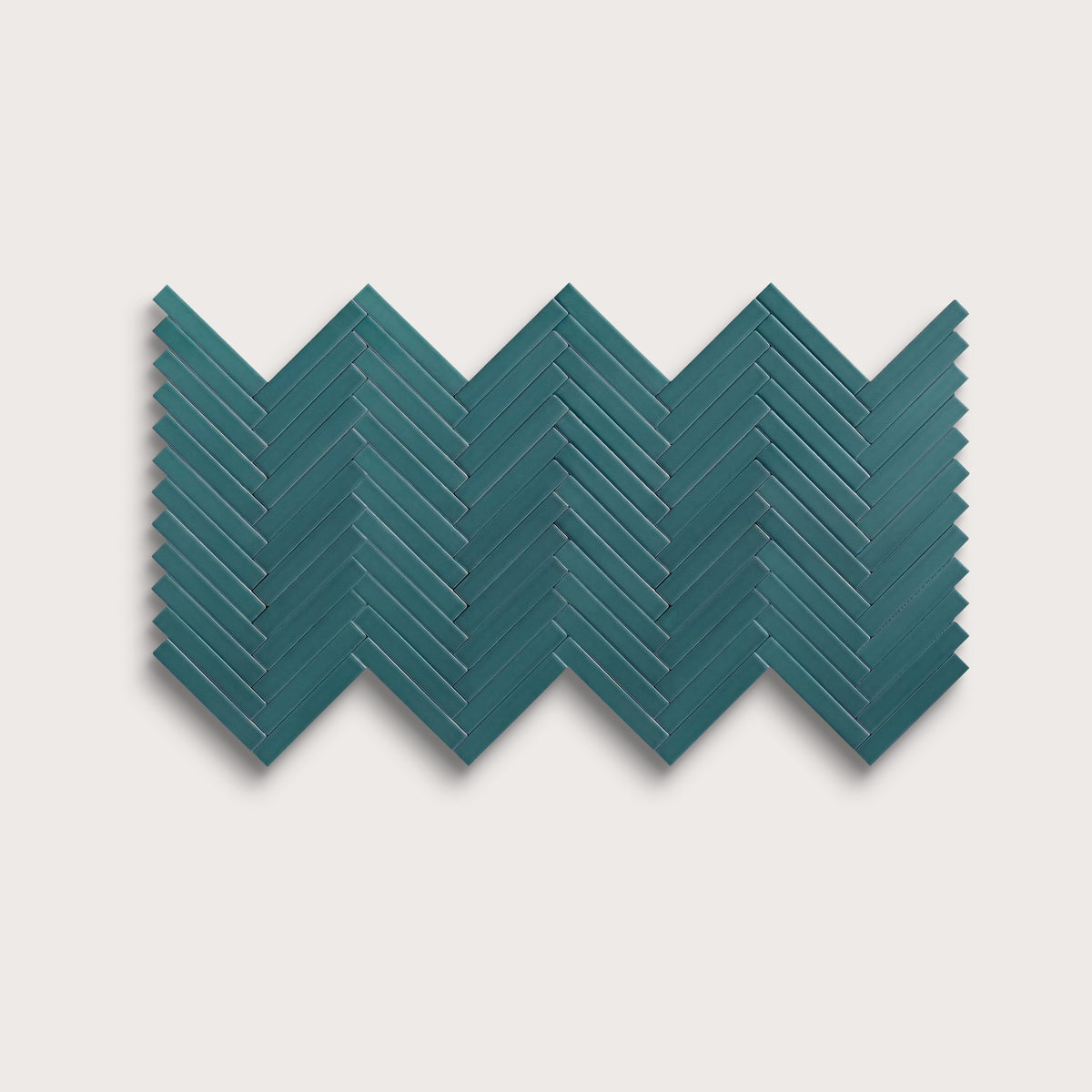 Aegean Blue ceramic tile, 1 by 6 inch herringbone mosaic, matte finish