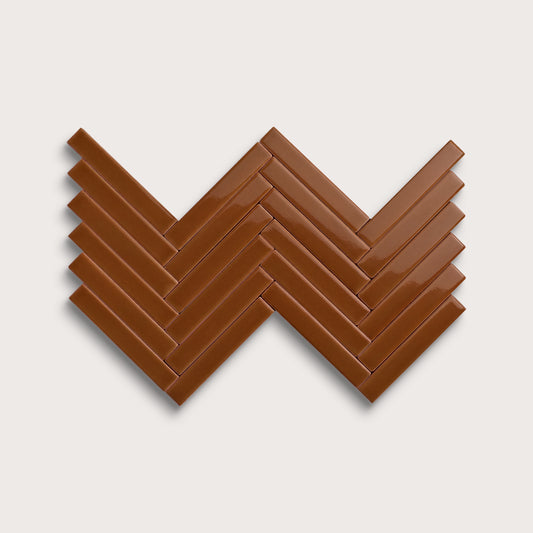 Amber ceramic tile, 1 by 6 inch herringbone mosaic, gloss finish