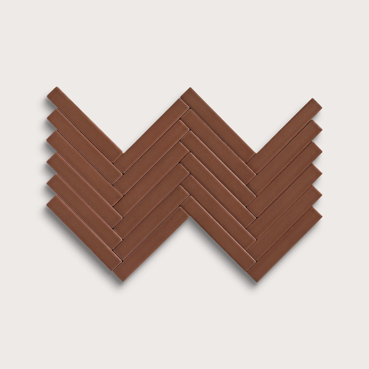Amber ceramic tile, 1 by 6 inch herringbone mosaic, matte finish