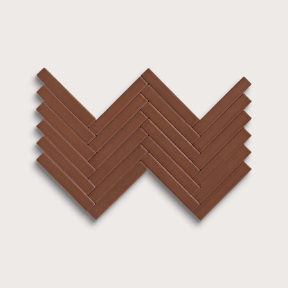 Amber ceramic tile, 1 by 6 inch herringbone mosaic, matte finish