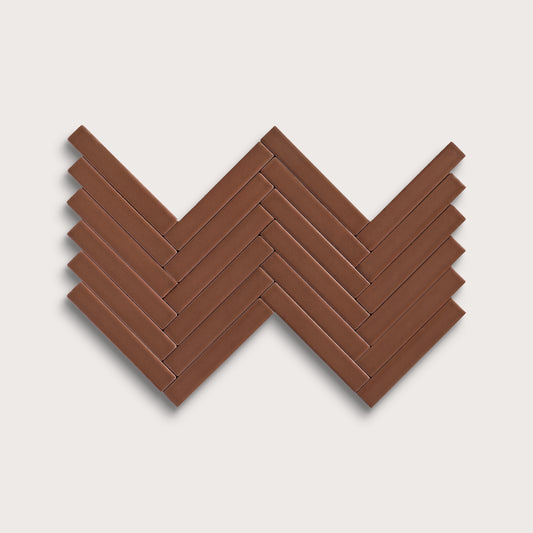 Amber ceramic tile, 1 by 6 inch herringbone mosaic, matte finish