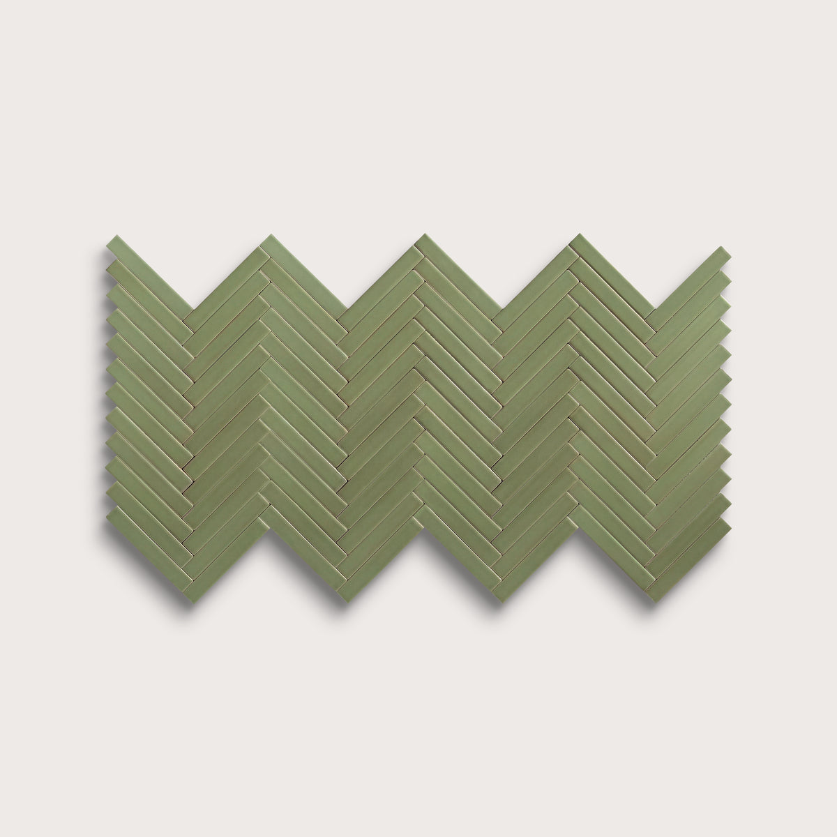 Cactus Green ceramic tile, 1 by 6 inch herringbone mosaic, matte finish