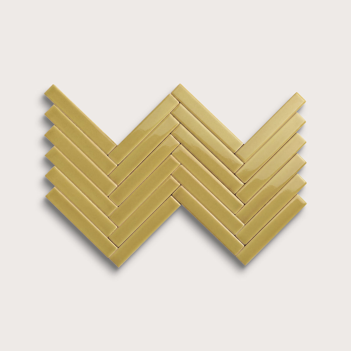 Citron ceramic tile, 1 by 6 inch herringbone mosaic, gloss finish