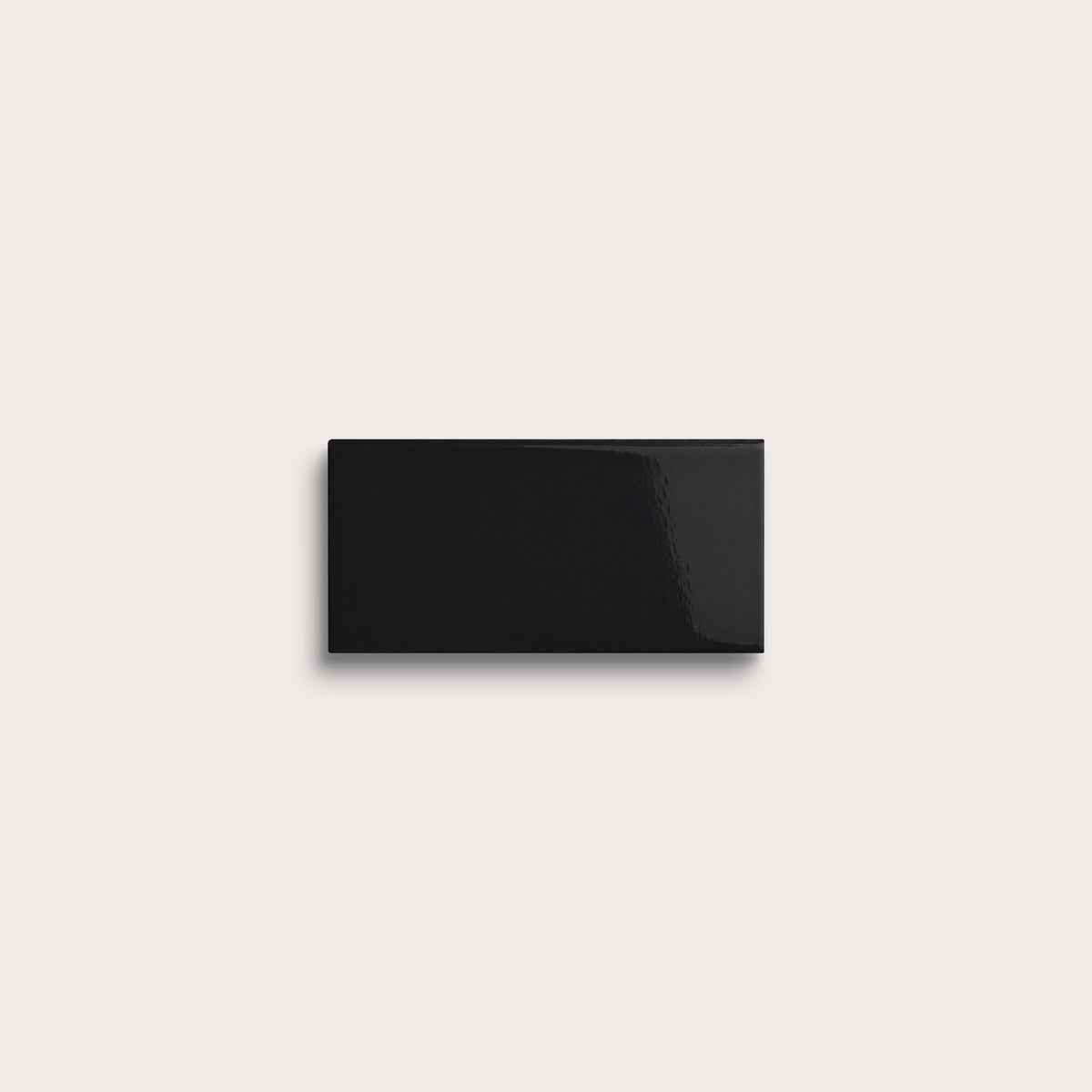 Deep Black ceramic tile sample, gloss finish