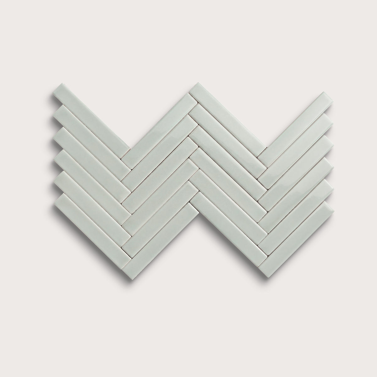 Echo ceramic tile, 1 by 6 inch herringbone mosaic, gloss finish