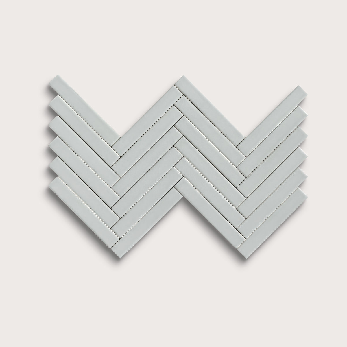 Echo ceramic tile, 1 by 6 inch herringbone mosaic, matte finish