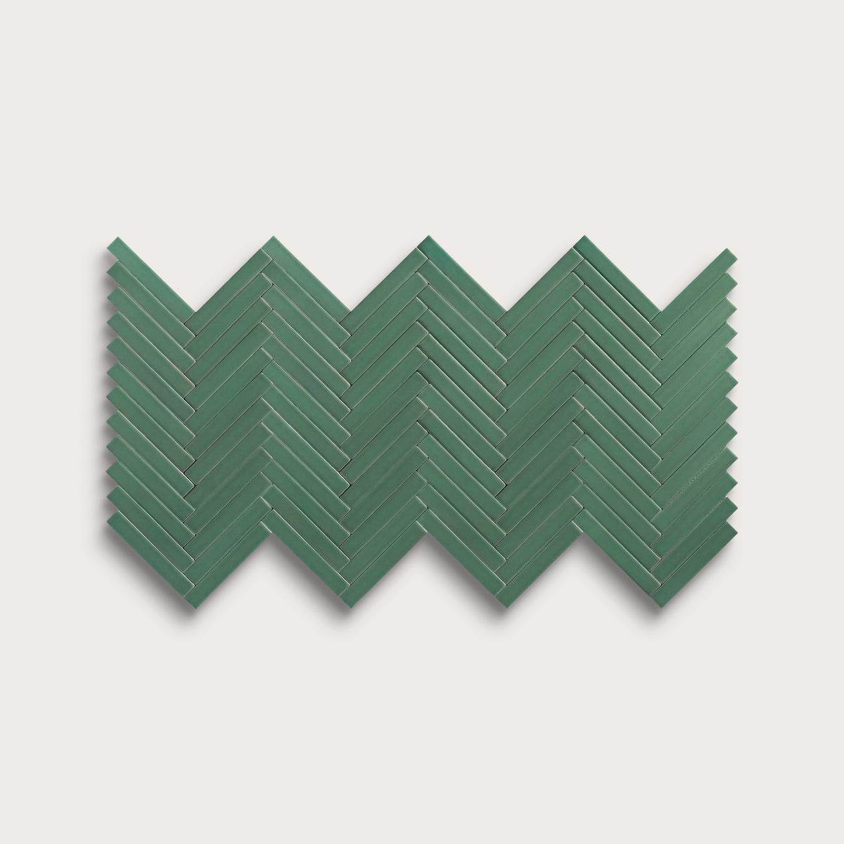 Evergreen ceramic tile, 1 by 6 inch herringbone mosaic, matte finish