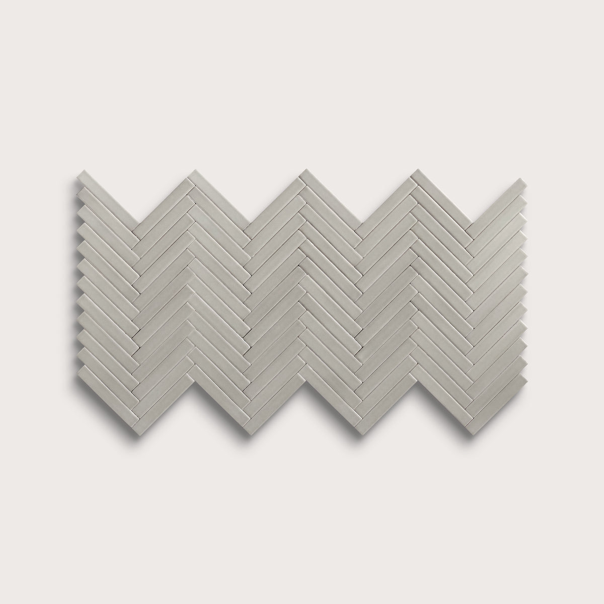 Fog ceramic tile, 1 by 6 inch herringbone mosaic, matte finish
