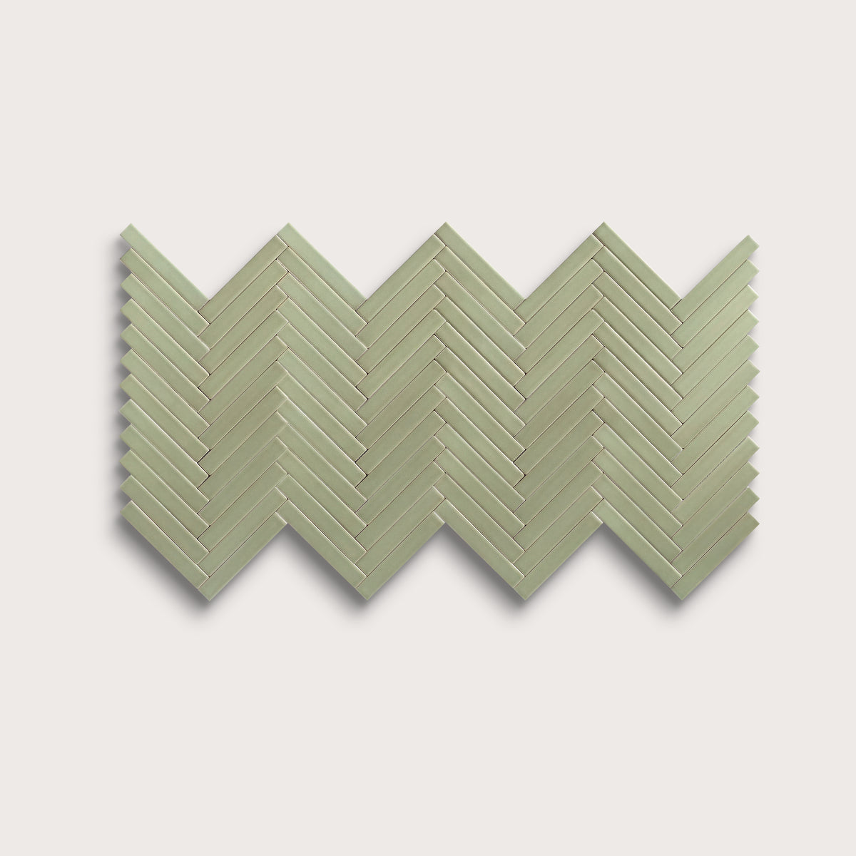 Ghetty Green ceramic tile, 1 by 6 inch herringbone mosaic, matte finish