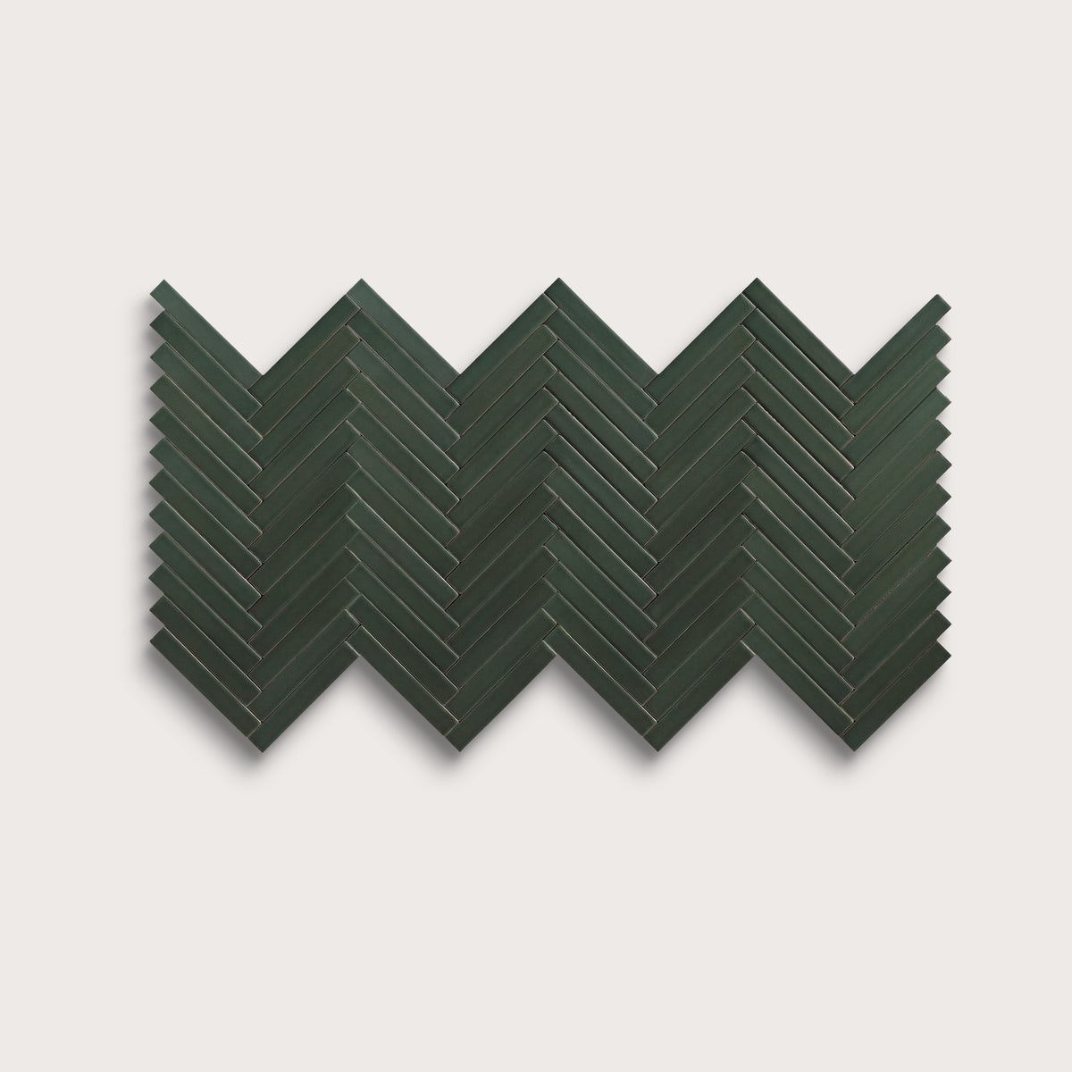 Green River ceramic tile, 1 by 6 inch herringbone mosaic, matte finish