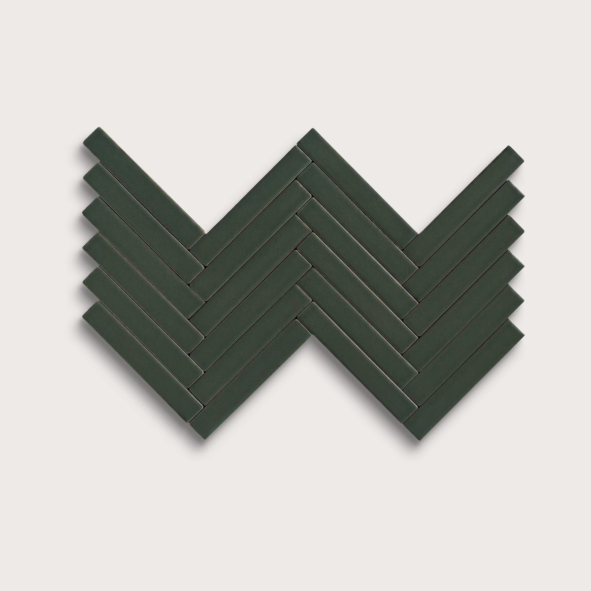 Green River ceramic tile, 1 by 6 inch herringbone mosaic, matte finish