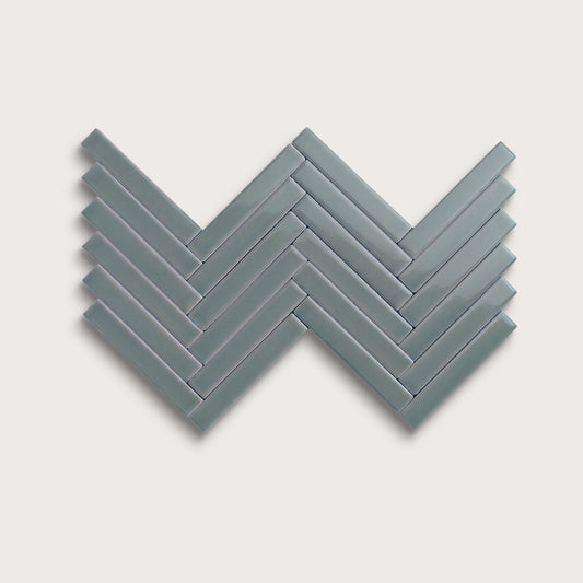 Grey Street ceramic tile, 1 by 6 inch herringbone mosaic, gloss finish