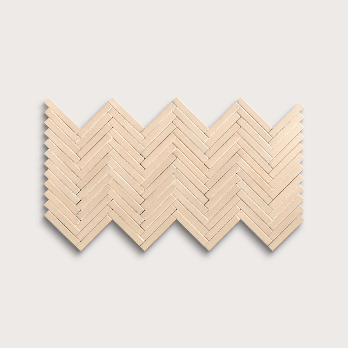 Latte ceramic tile, 1 by 6 inch herringbone mosaic, matte finish