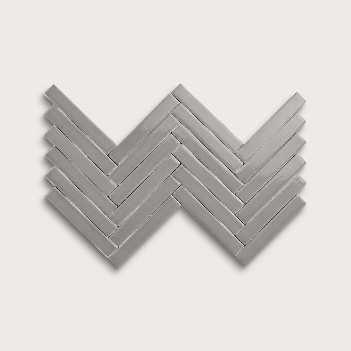 Lunar ceramic tile, 1 by 6 inch herringbone mosaic, gloss finish