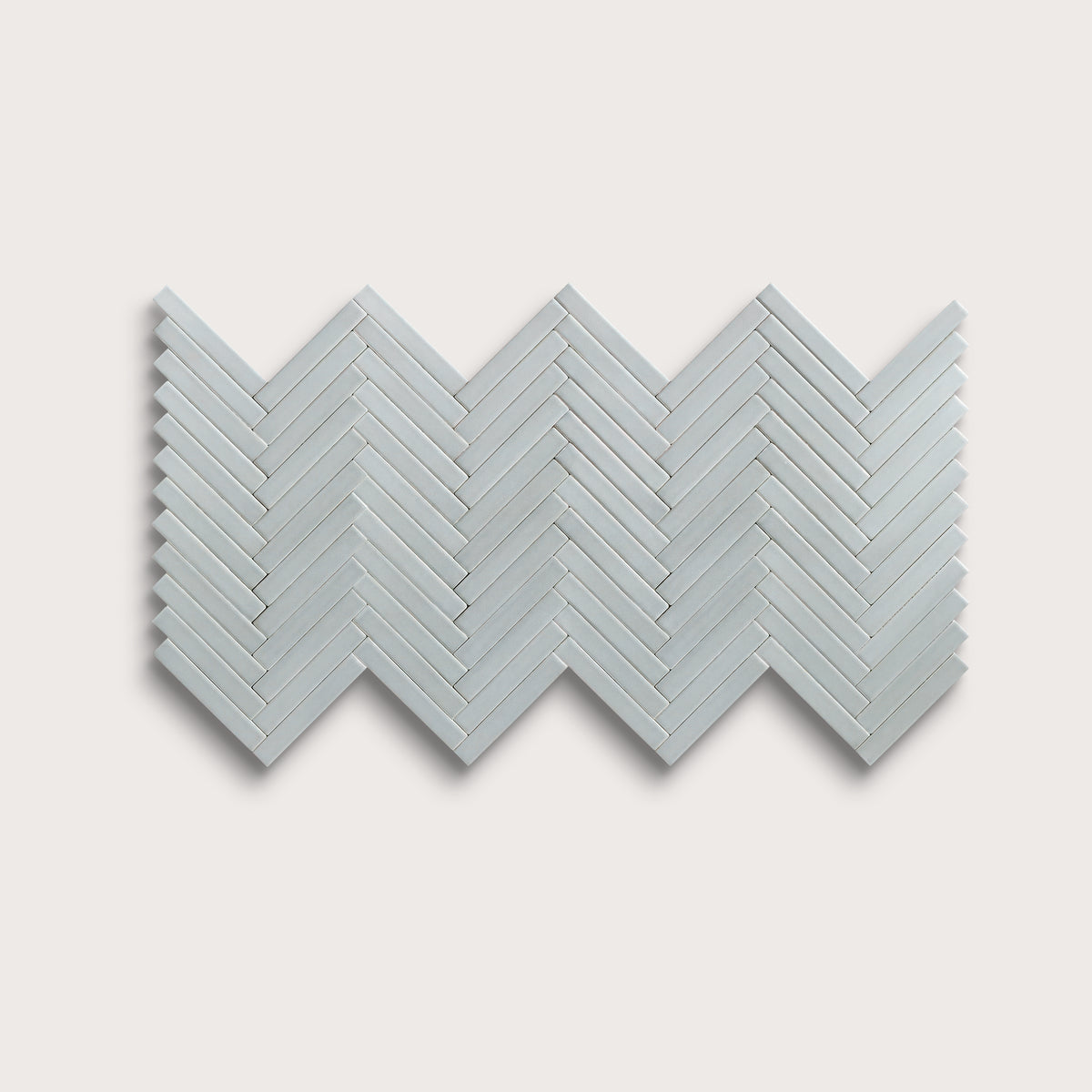 Misty ceramic tile, 1 by 6 inch herringbone mosaic, matte finish