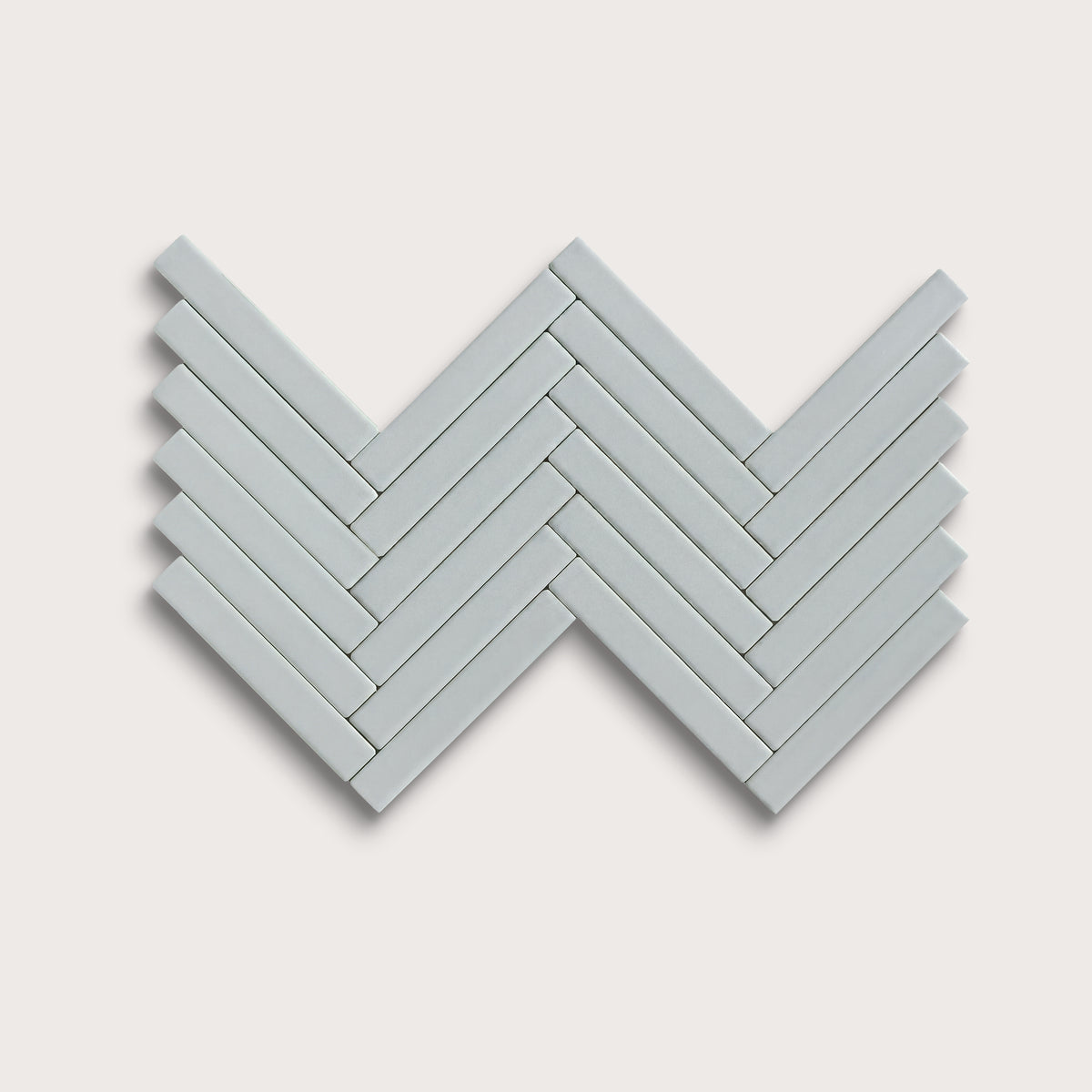 Misty ceramic tile, 1 by 6 inch herringbone mosaic, matte finish