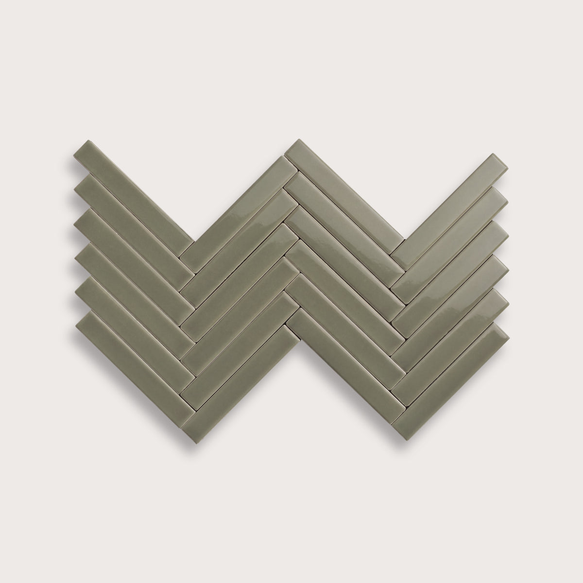 Moss ceramic tile, 1 by 6 inch herringbone mosaic, gloss finish