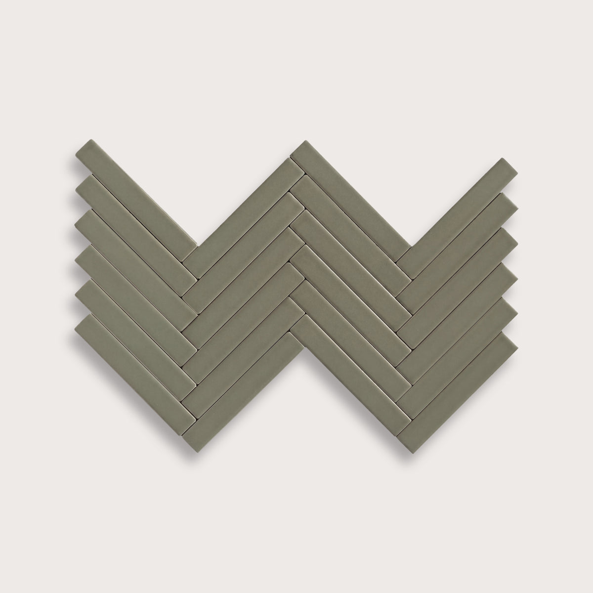 Moss ceramic tile, 1 by 6 inch herringbone mosaic, matte finish