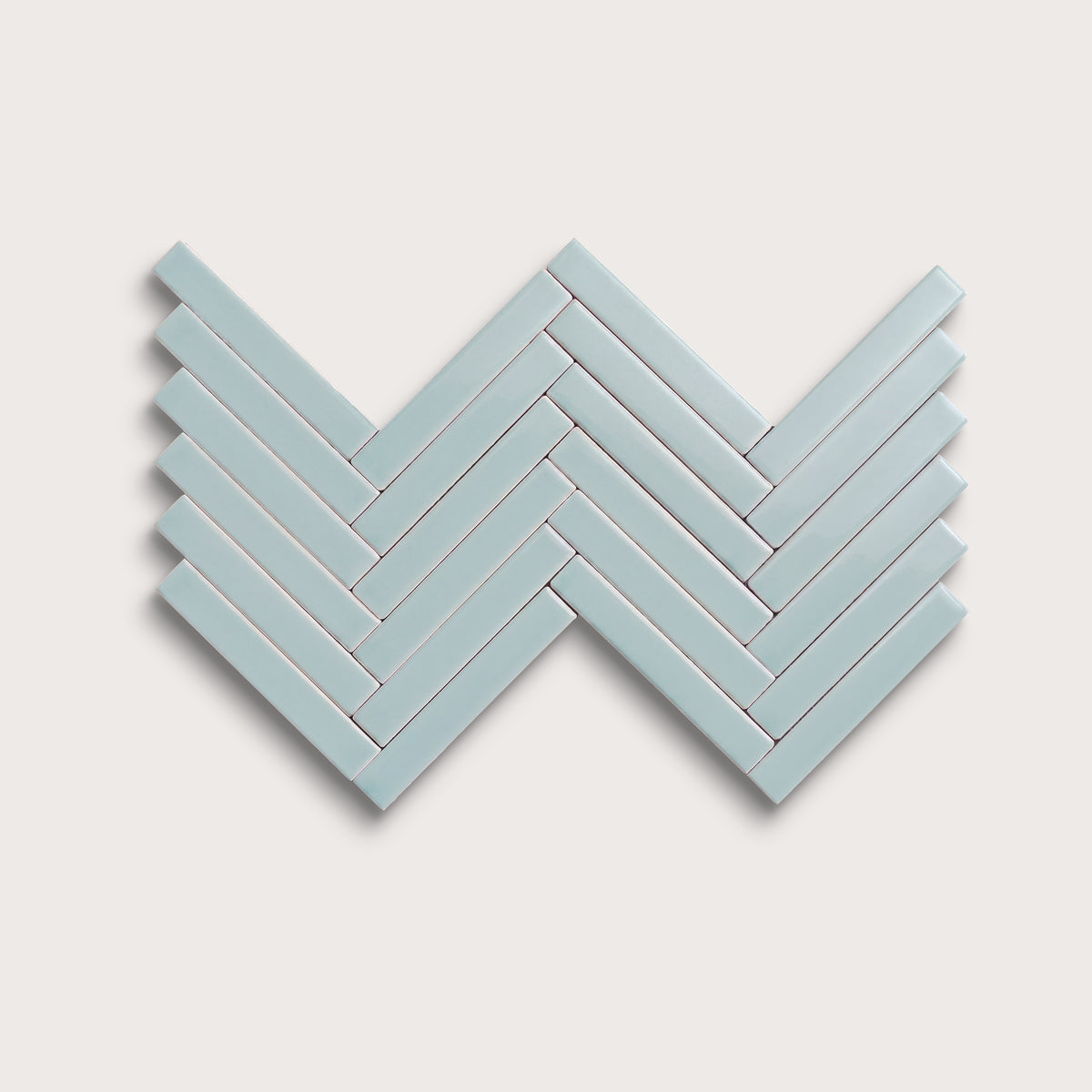 Powder Blue ceramic tile, 1 by 6 inch herringbone mosaic, gloss finish