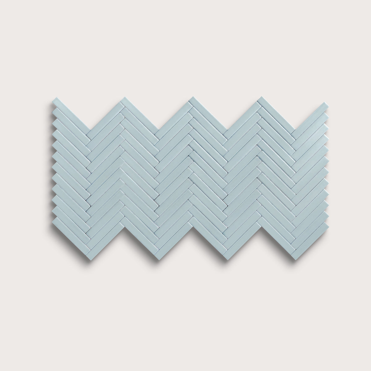 Powder Blue ceramic tile, 1 by 6 inch herringbone mosaic, matte finish