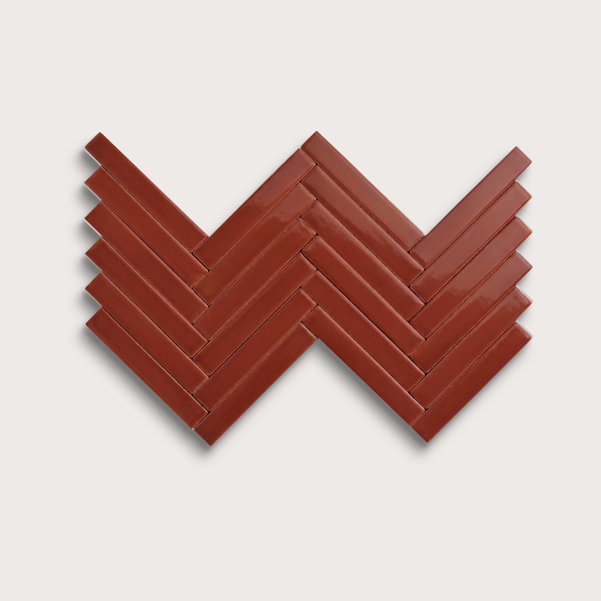 Raspberry Beret ceramic tile, 1 by 6 inch herringbone mosaic, gloss finish