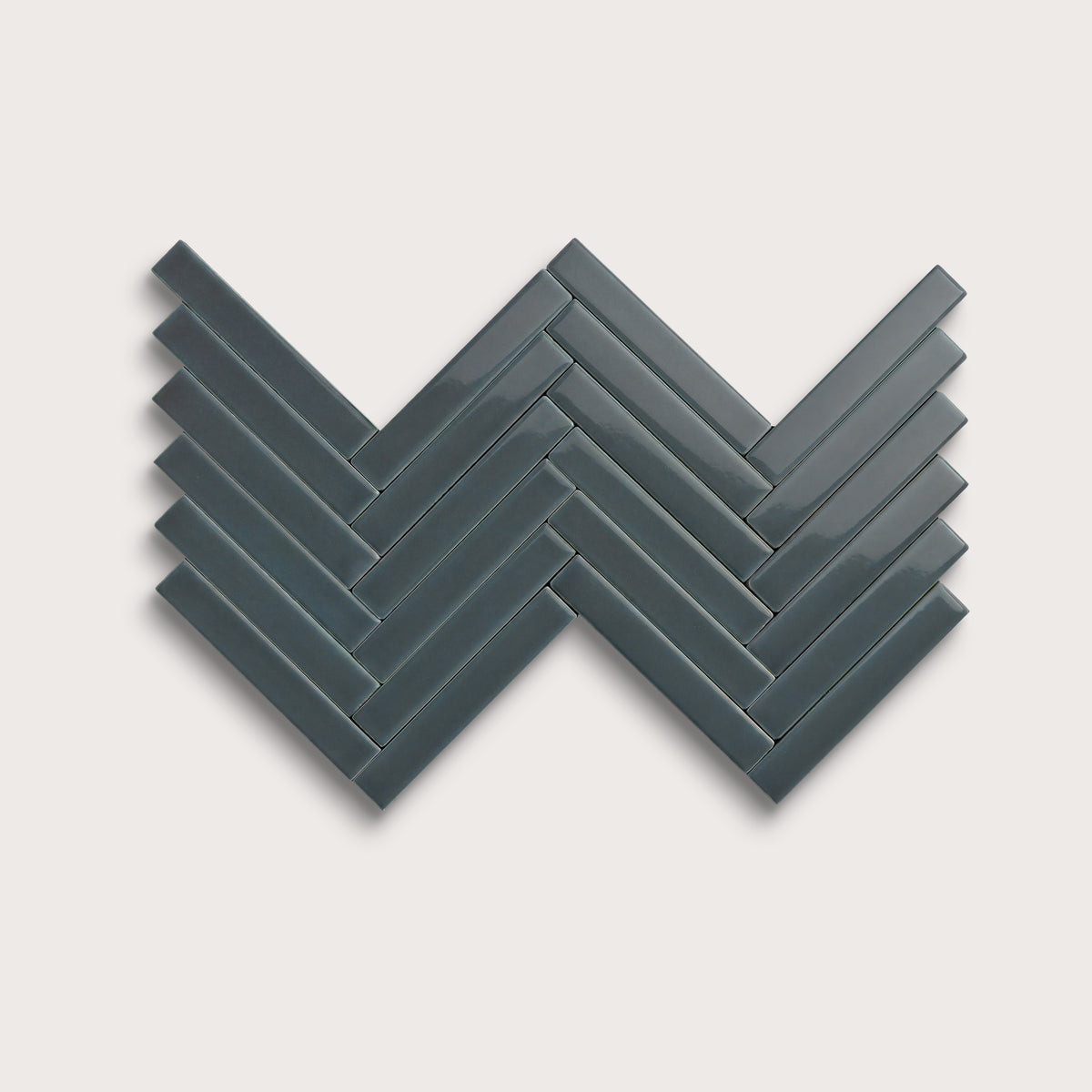 Smoke ceramic tile, 1 by 6 inch herringbone mosaic, gloss finish