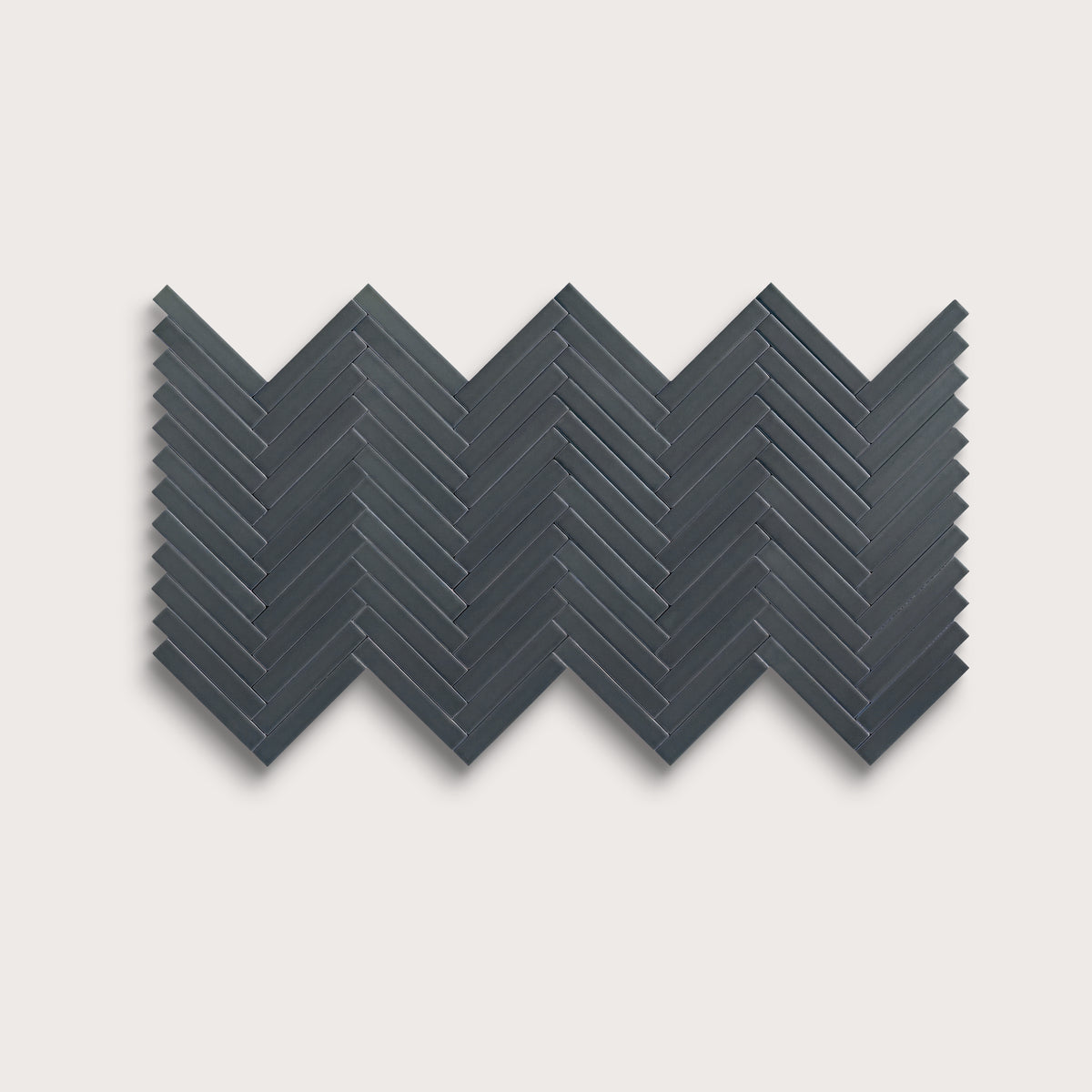 Smoke ceramic tile, 1 by 6 inch herringbone mosaic, matte finish