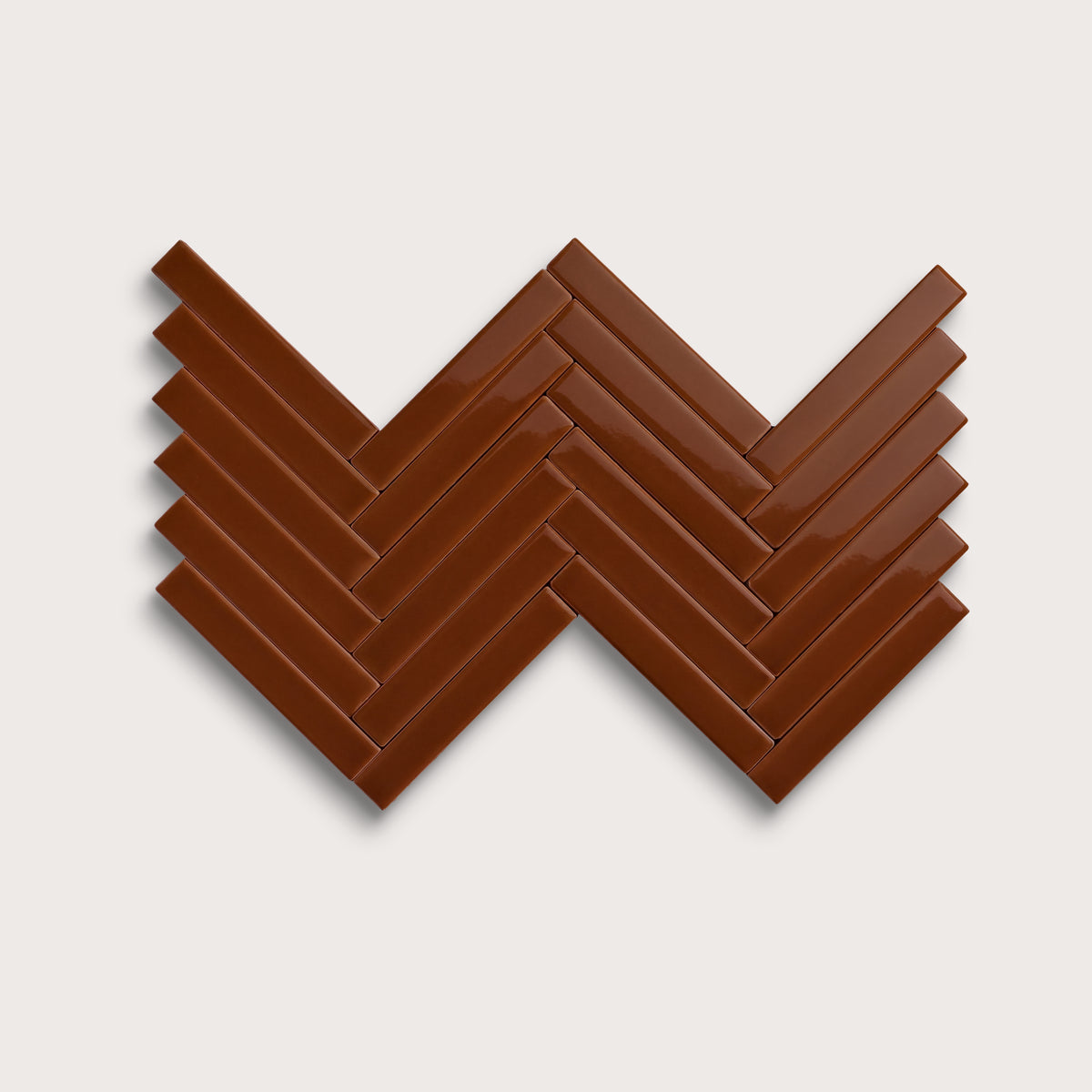 Spice ceramic tile, 1 by 6 inch herringbone mosaic, gloss finish