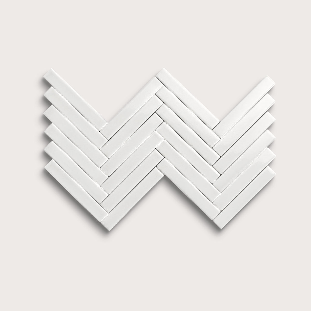 White ceramic tile, 1 by 6 inch herringbone mosaic, gloss finish