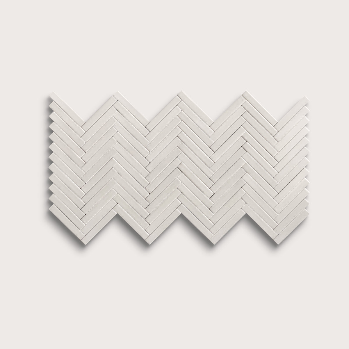 White ceramic tile, 1 by 6 inch herringbone mosaic, matte finish