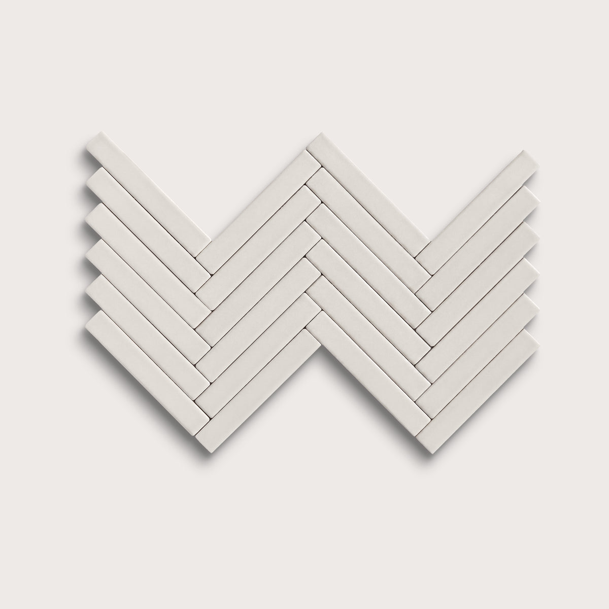 White ceramic tile, 1 by 6 inch herringbone mosaic, matte finish