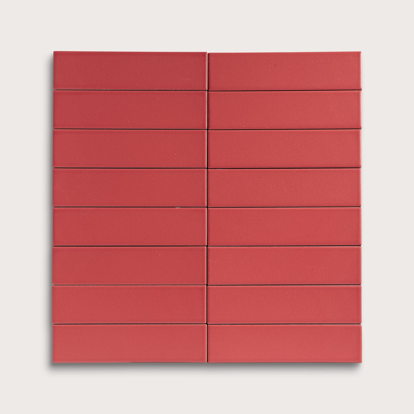 Red rectangular ceramic tile arranged in a grid pattern on a white background