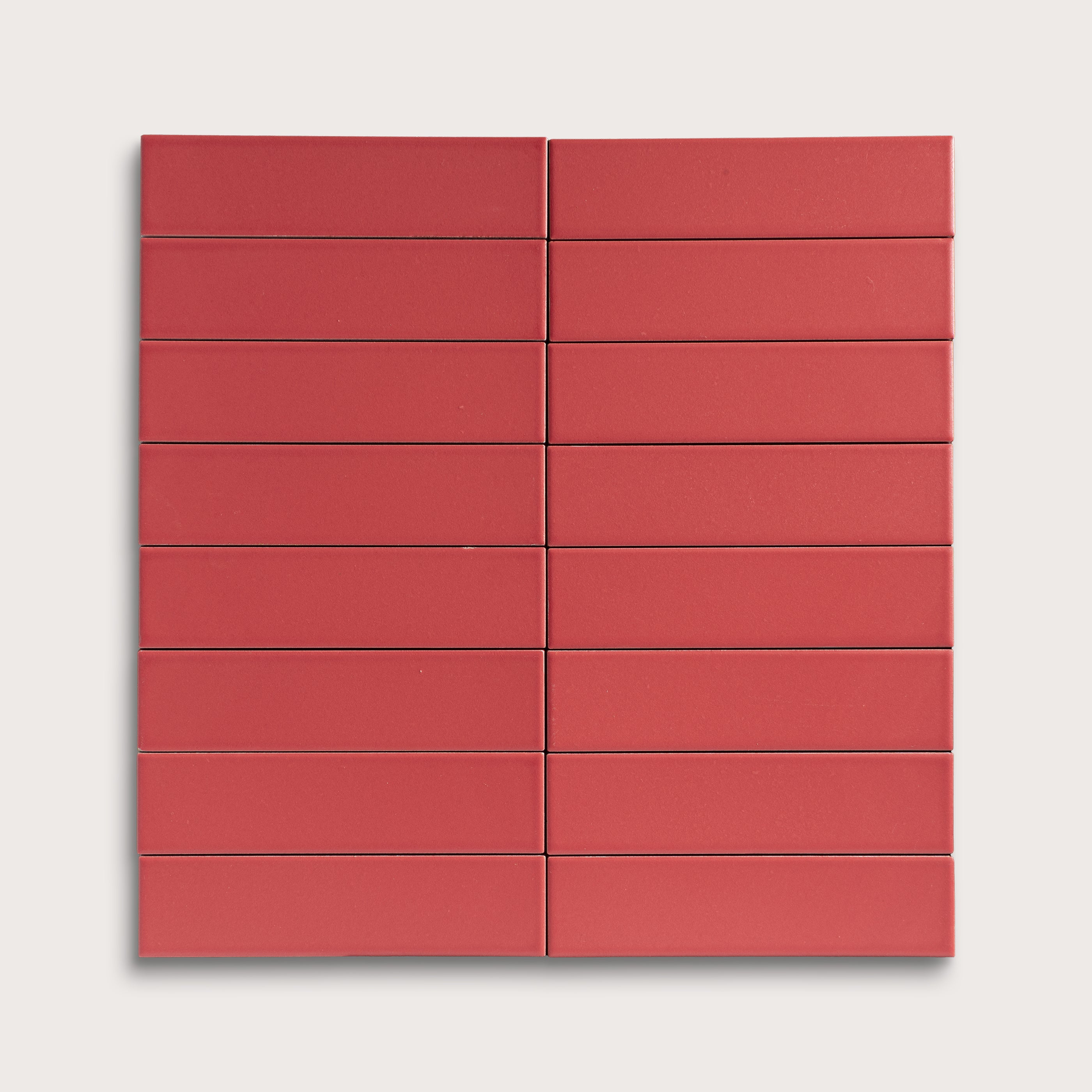Red rectangular ceramic tile arranged in a grid pattern on a white background