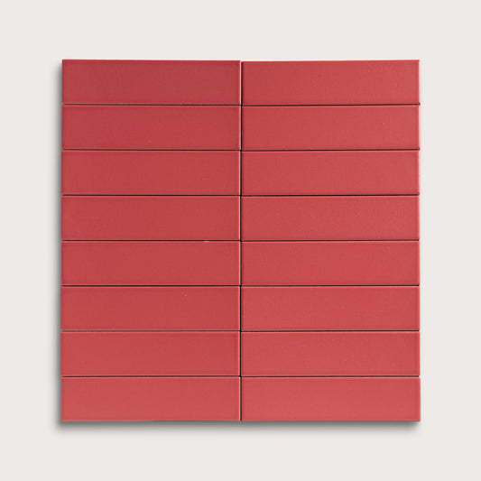 Red rectangular ceramic tile arranged in a grid pattern on a white background