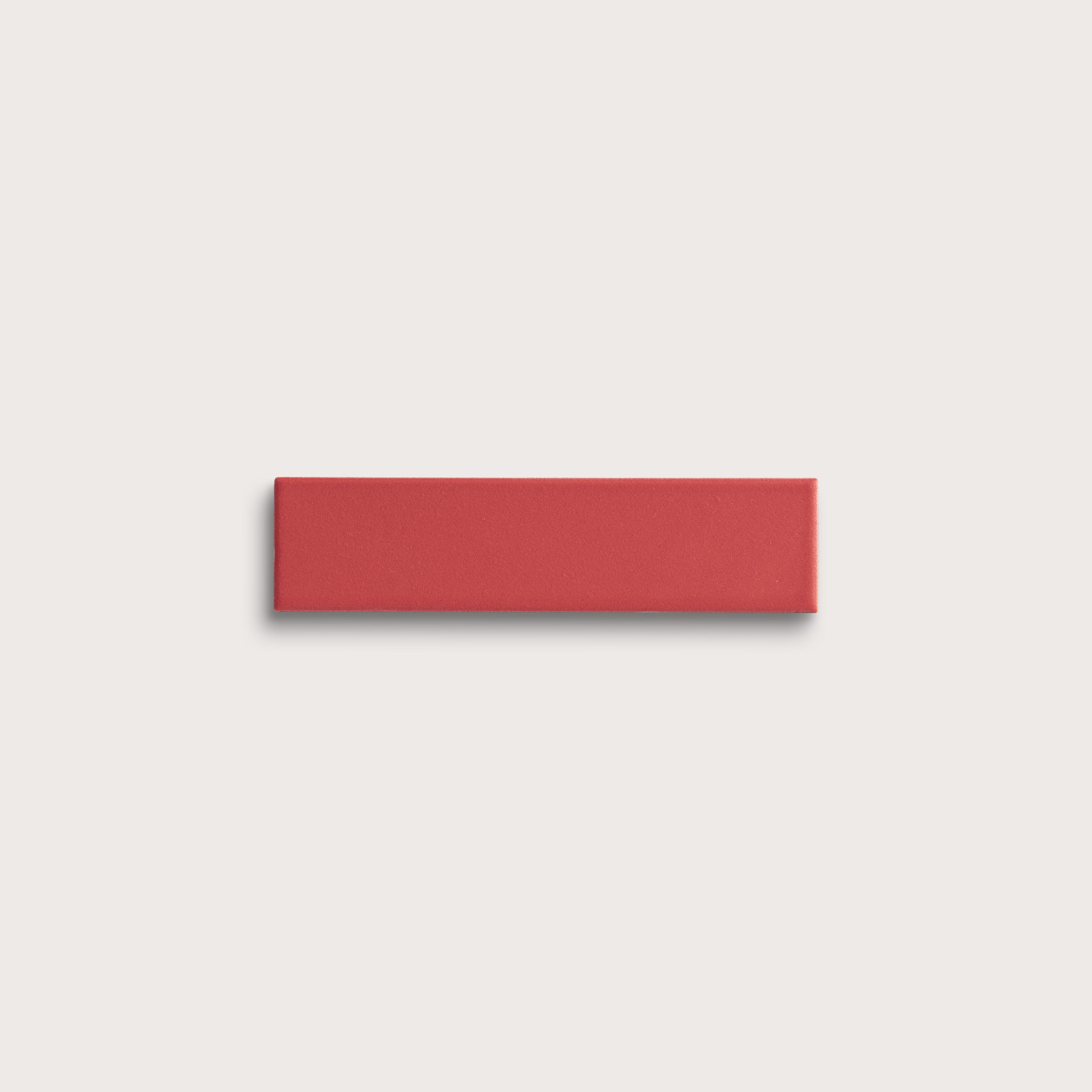 red rectangle ceramic tile on light grey background
