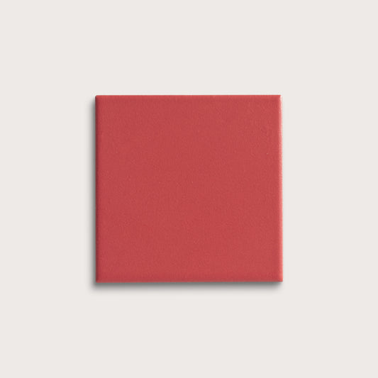 Red square tile on a light gray background