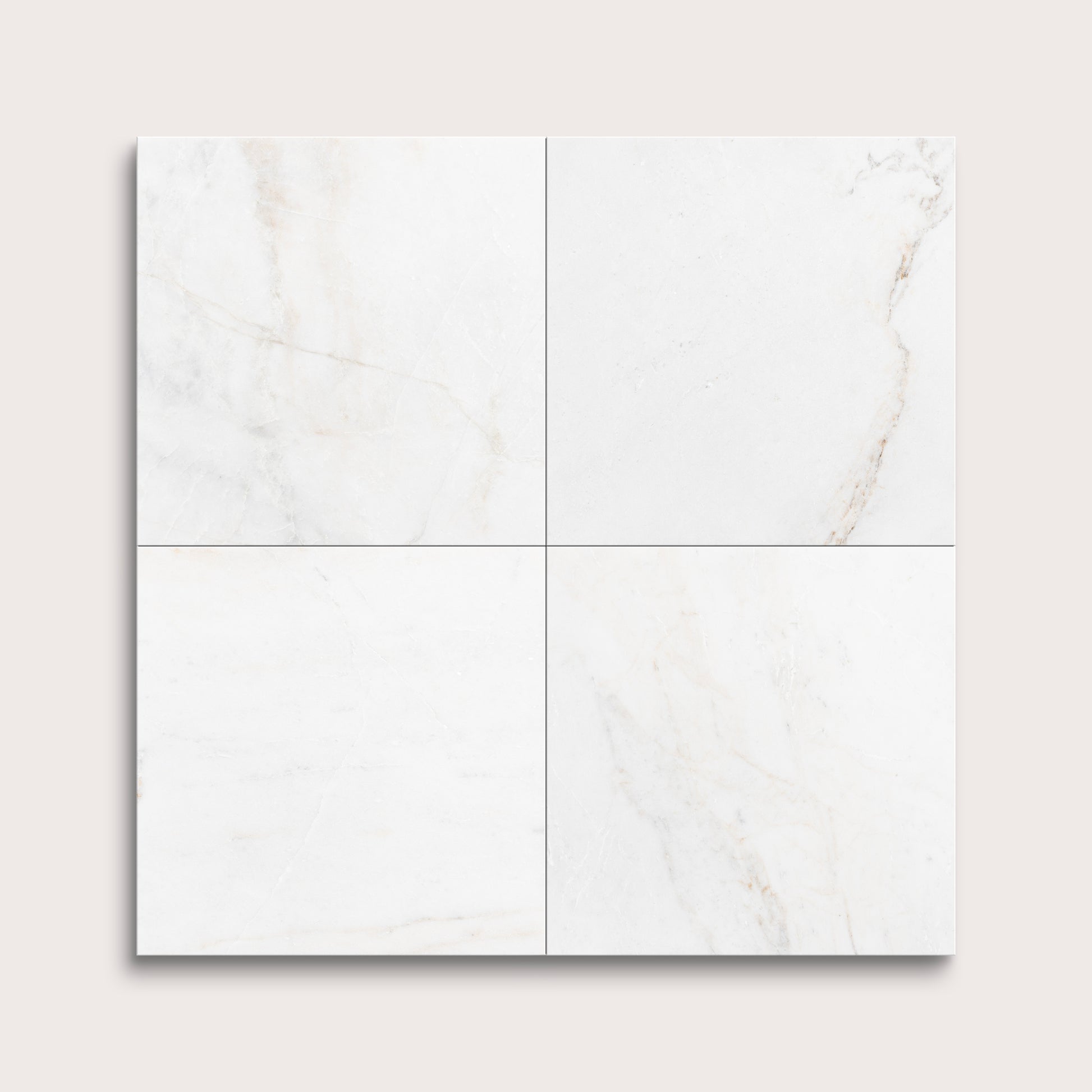 casablanca gold White marble tiles arranged in a grid pattern on a light gray background