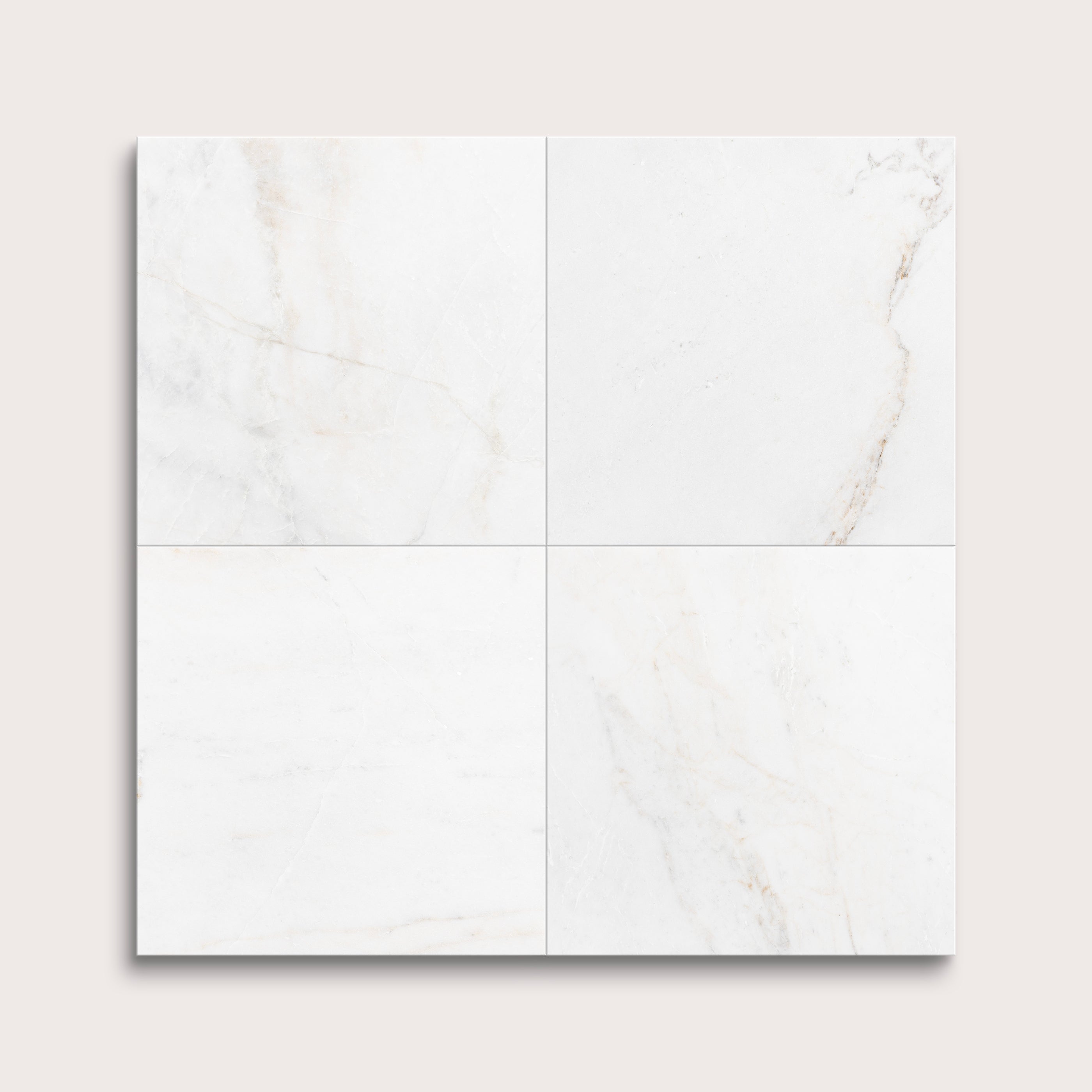 casablanca gold White marble tiles arranged in a grid pattern on a light gray background