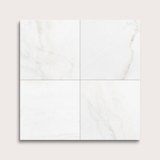 casablanca gold White marble tiles arranged in a grid pattern on a light gray background