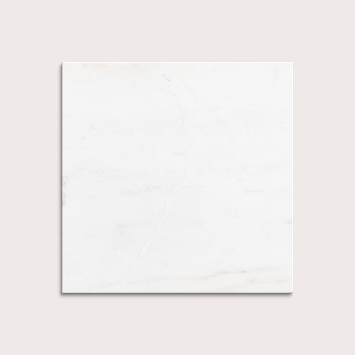 casablanca gold White marble tiles on a light gray background