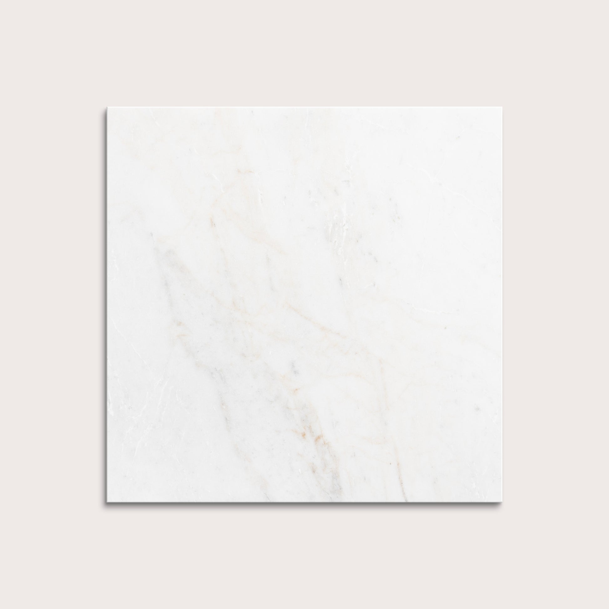 casablanca gold White marble tiles on a light gray background
