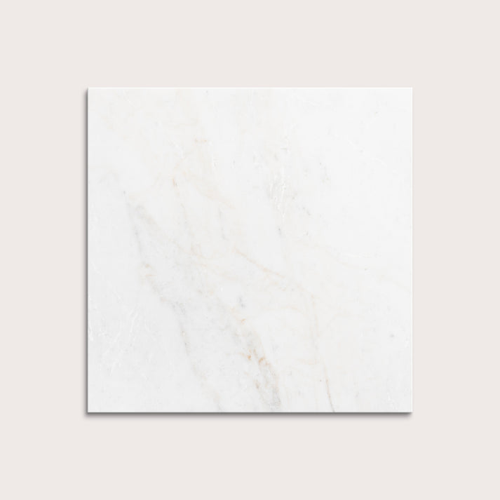 casablanca gold White marble tiles on a light gray background
