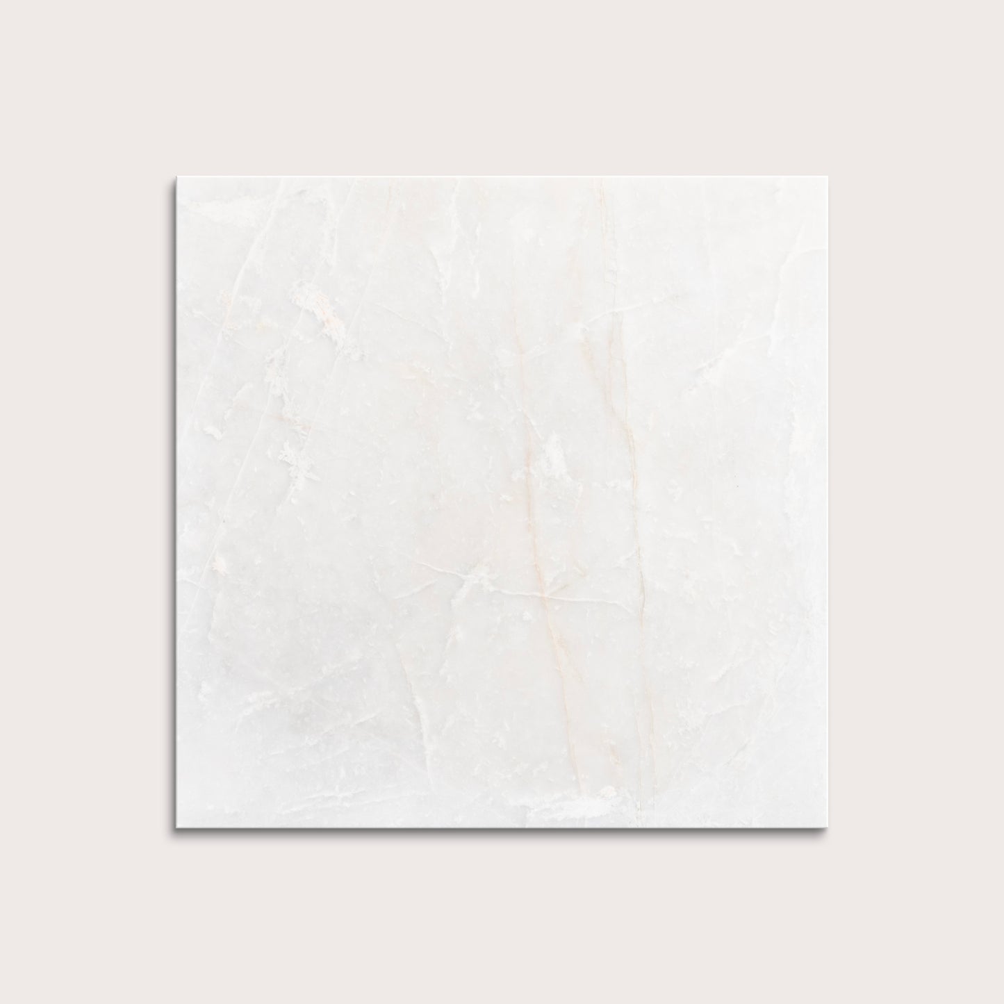 casablanca gold White marble tiles on a light gray background
