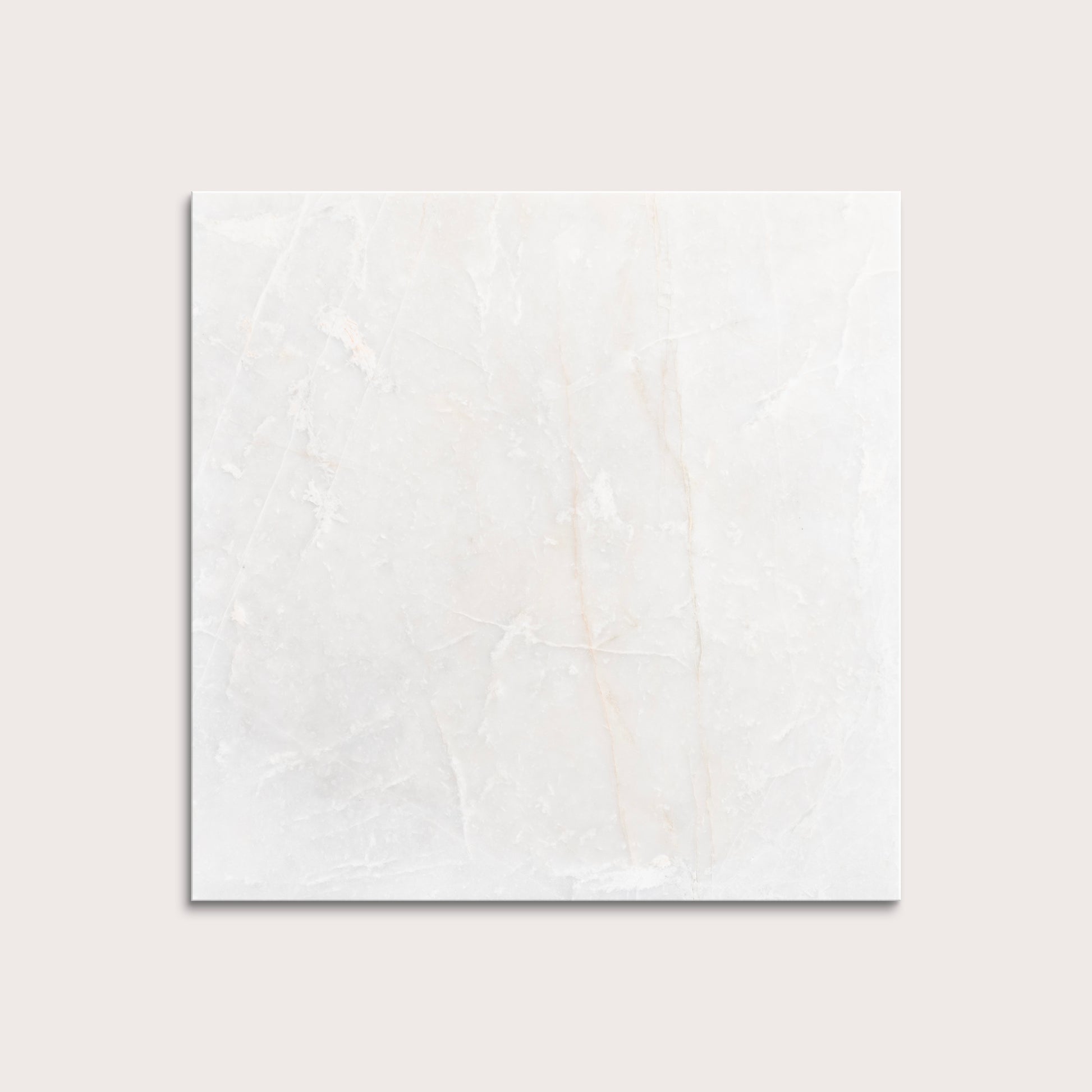 casablanca gold White marble tiles on a light gray background