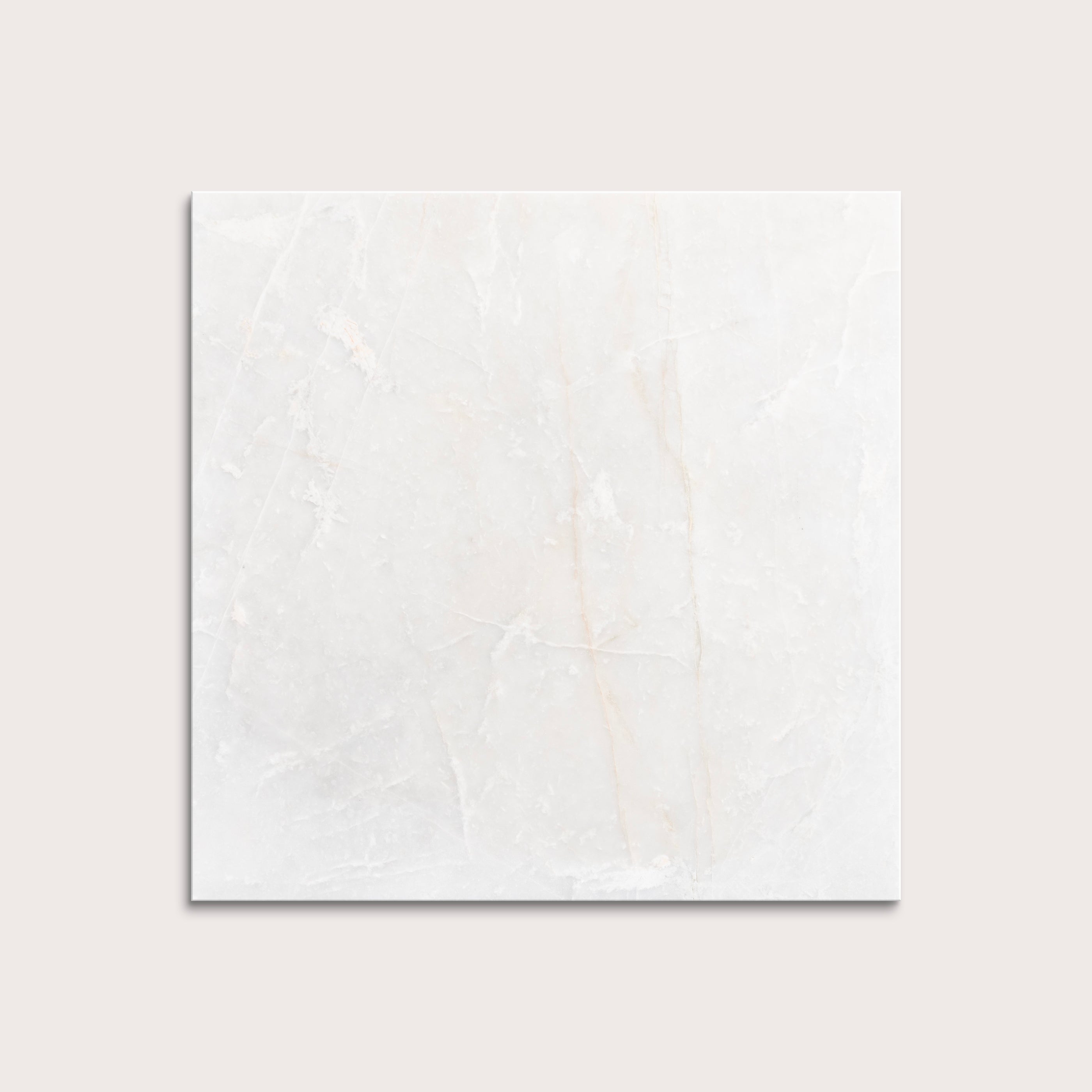 casablanca gold White marble tiles on a light gray background