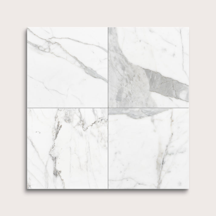 italian statuary white and grey marble tiles in a grid pattern on a light gray background